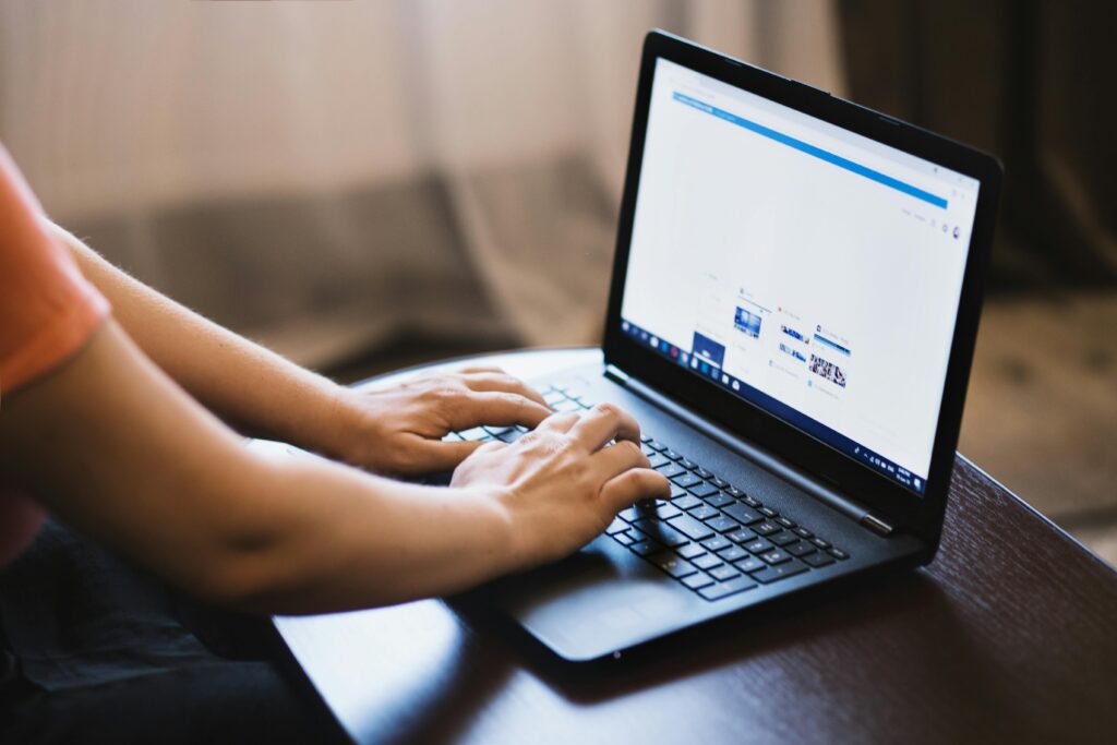 person on social media working on a laptop