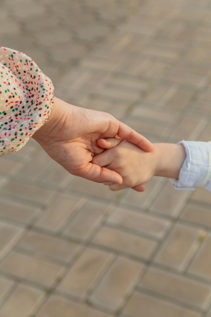 parent holds childs hand | how to regulate your emotions