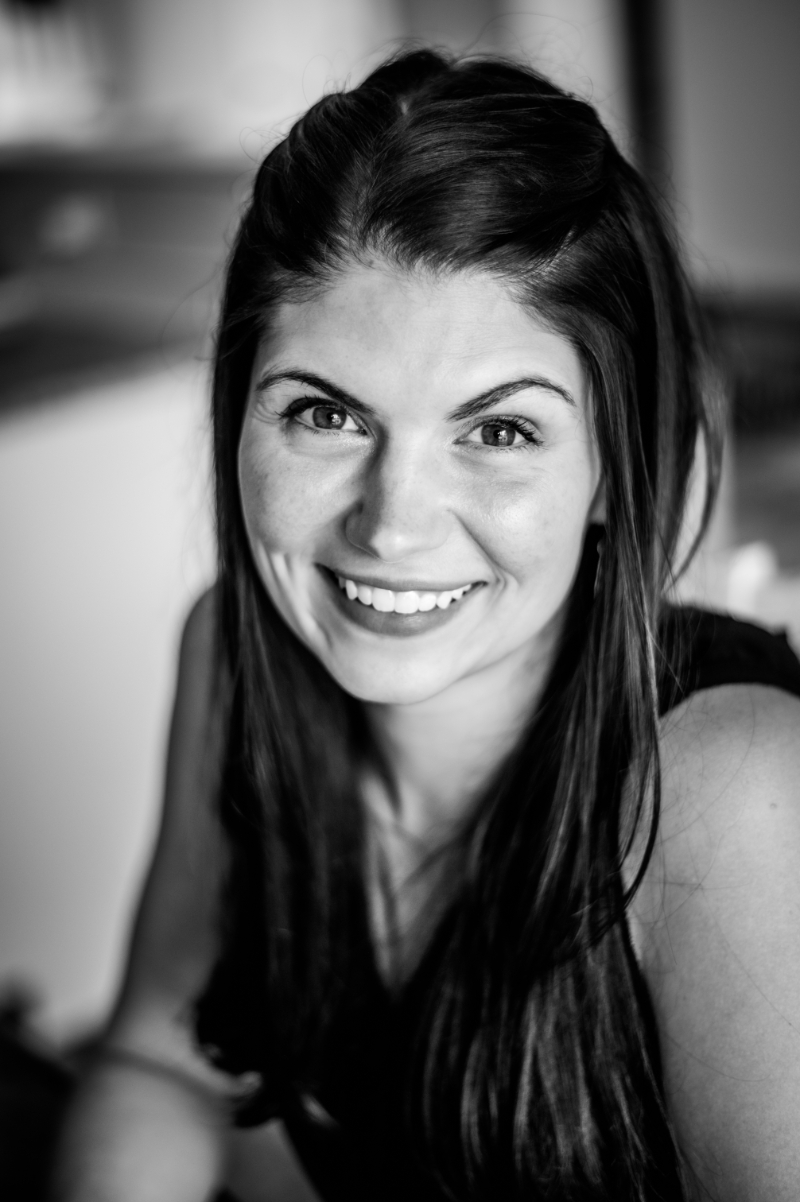 black and white shot of woman smiling at the camera